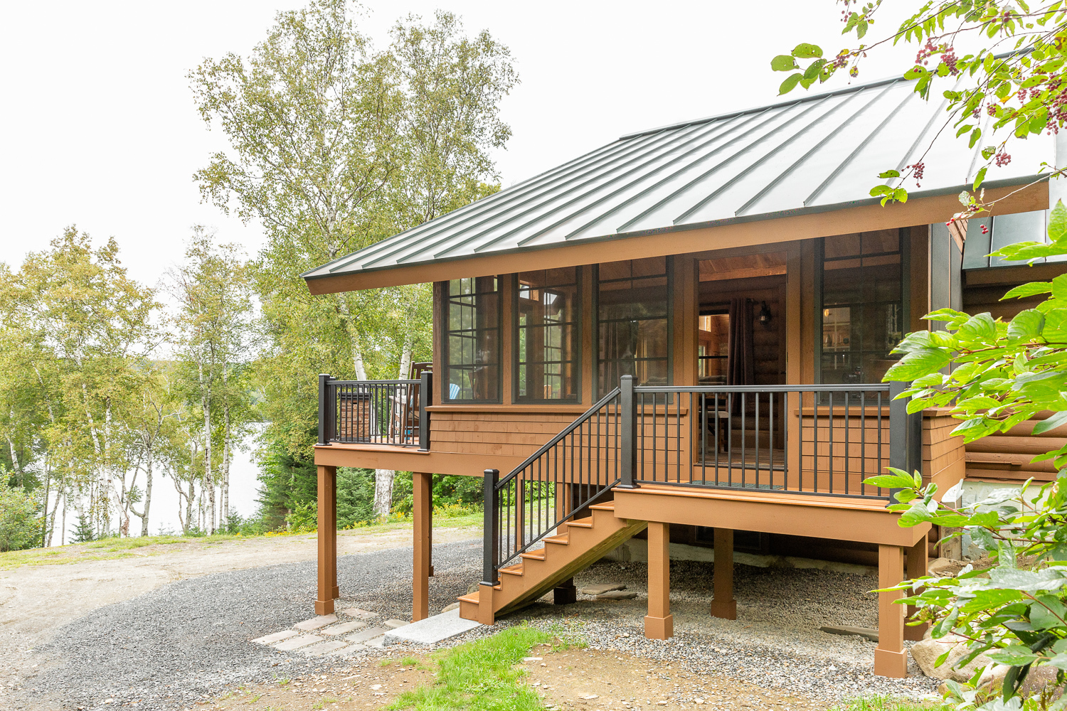 Three-season porch addition to an existing lakehouse