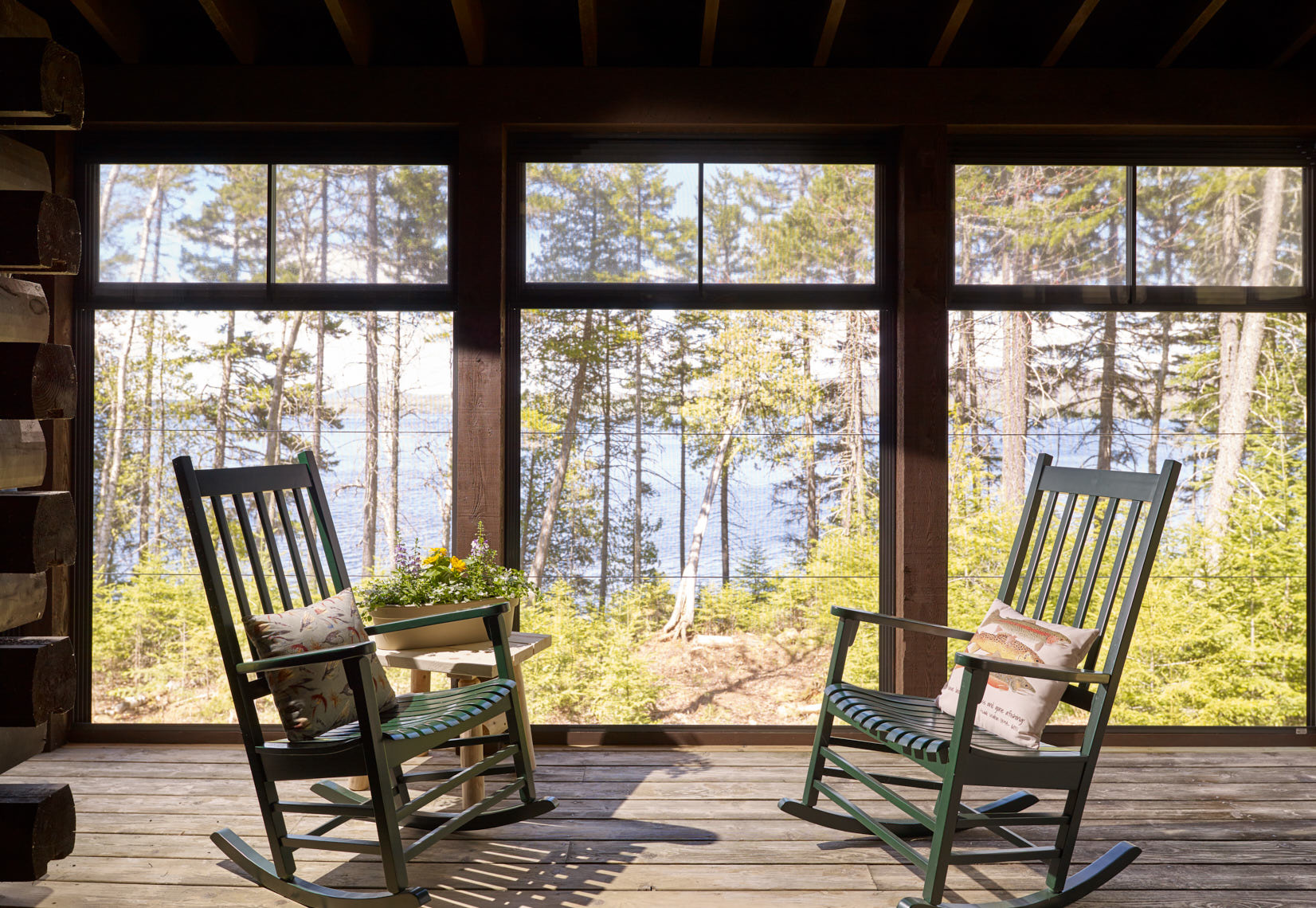 Three-season porch on a log home at Gentleman’s Camp