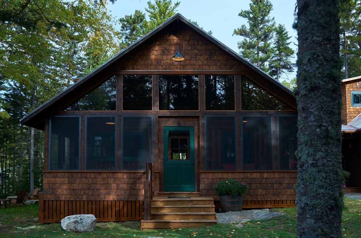 Three-season porch on a vintage camp (Breakwater Lodge)