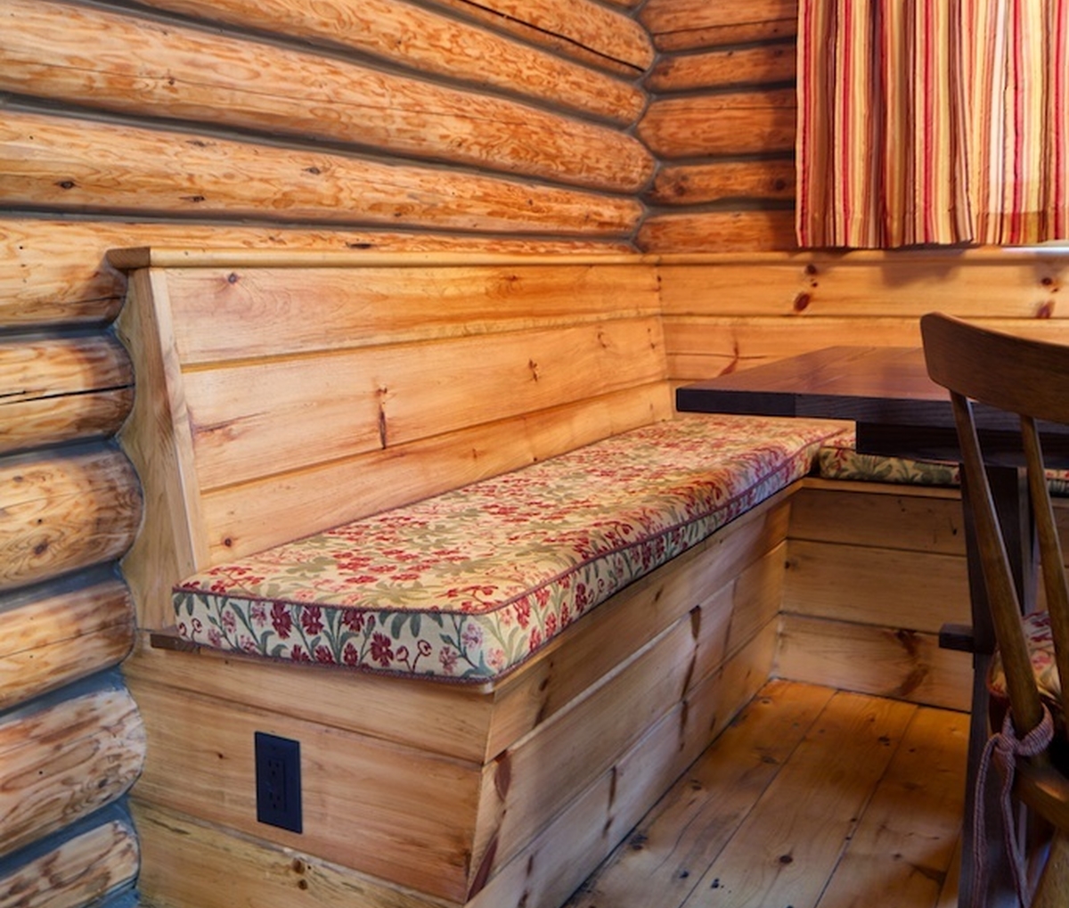 Built-in dining banquette in a log cabin